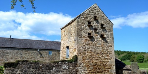 Stone built small tower with dovecot openings