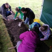 Visitors having a go at digging